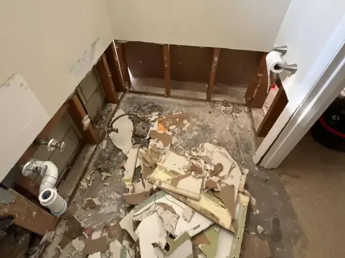 A bathroom stripped to the studs after a sewage backup cleanup